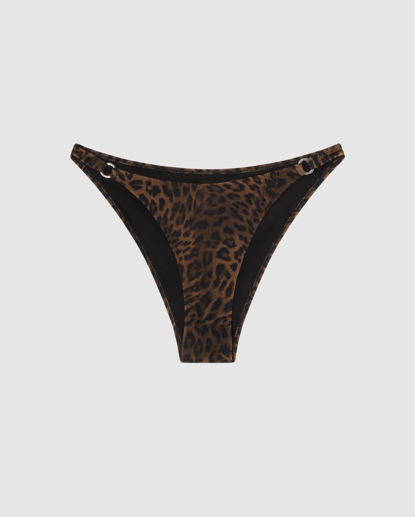An leopard print bikini bottom with ring accessories.