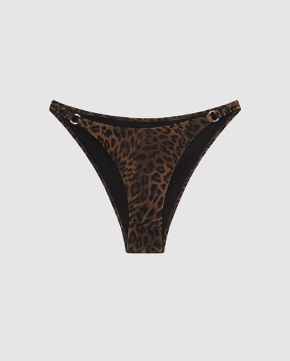 An leopard print bikini bottom with ring accessories.