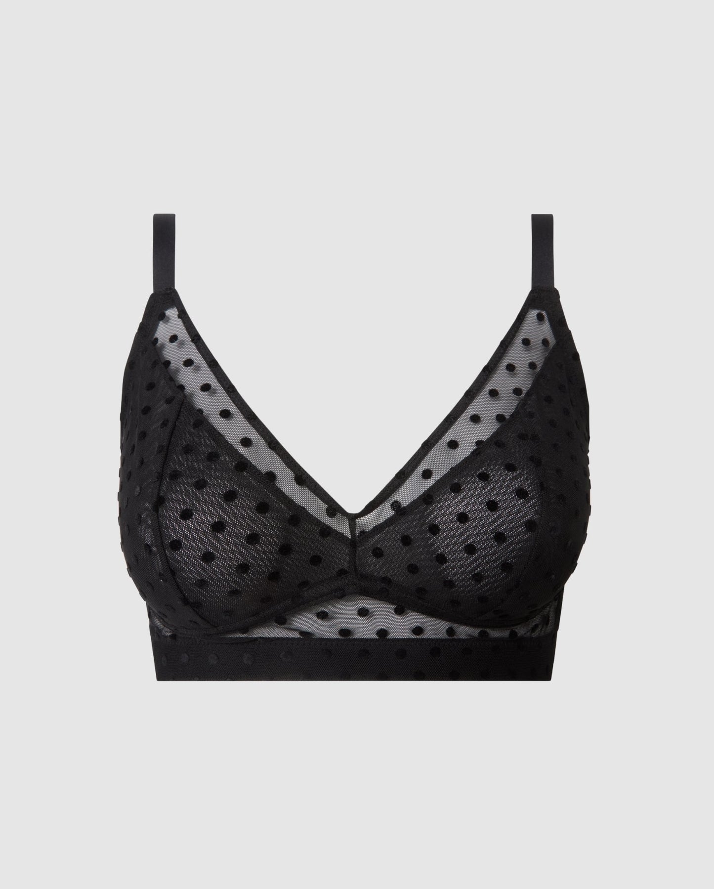An supportive mesh Bralette in a black color with an dotted design for larger cups with full coverage and adjustable straps for comfort and support.