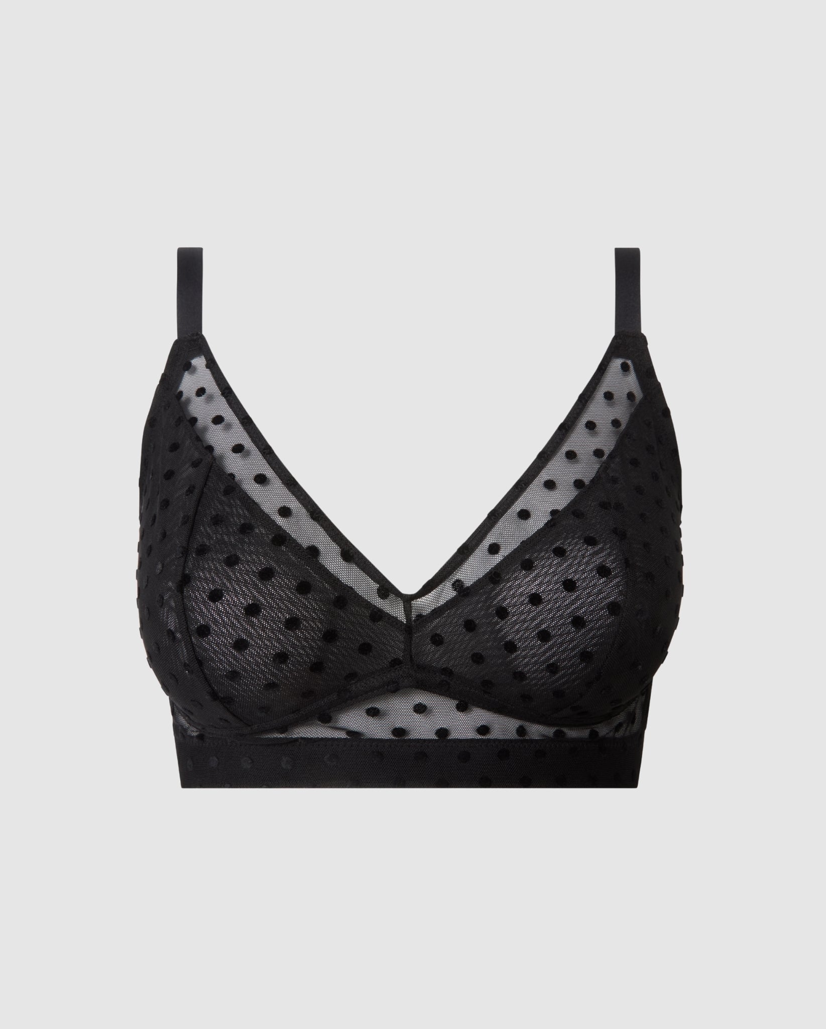 An supportive mesh Bralette in a black color with an dotted design for larger cups with full coverage and adjustable straps for comfort and support.