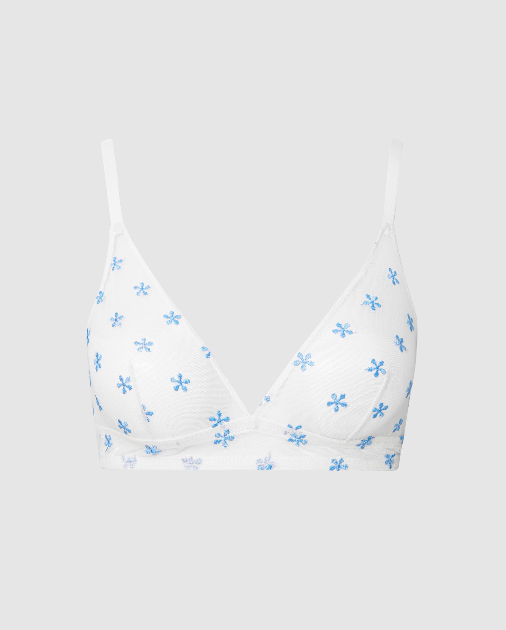 An mesh triangle bralette in white with blue flowers.