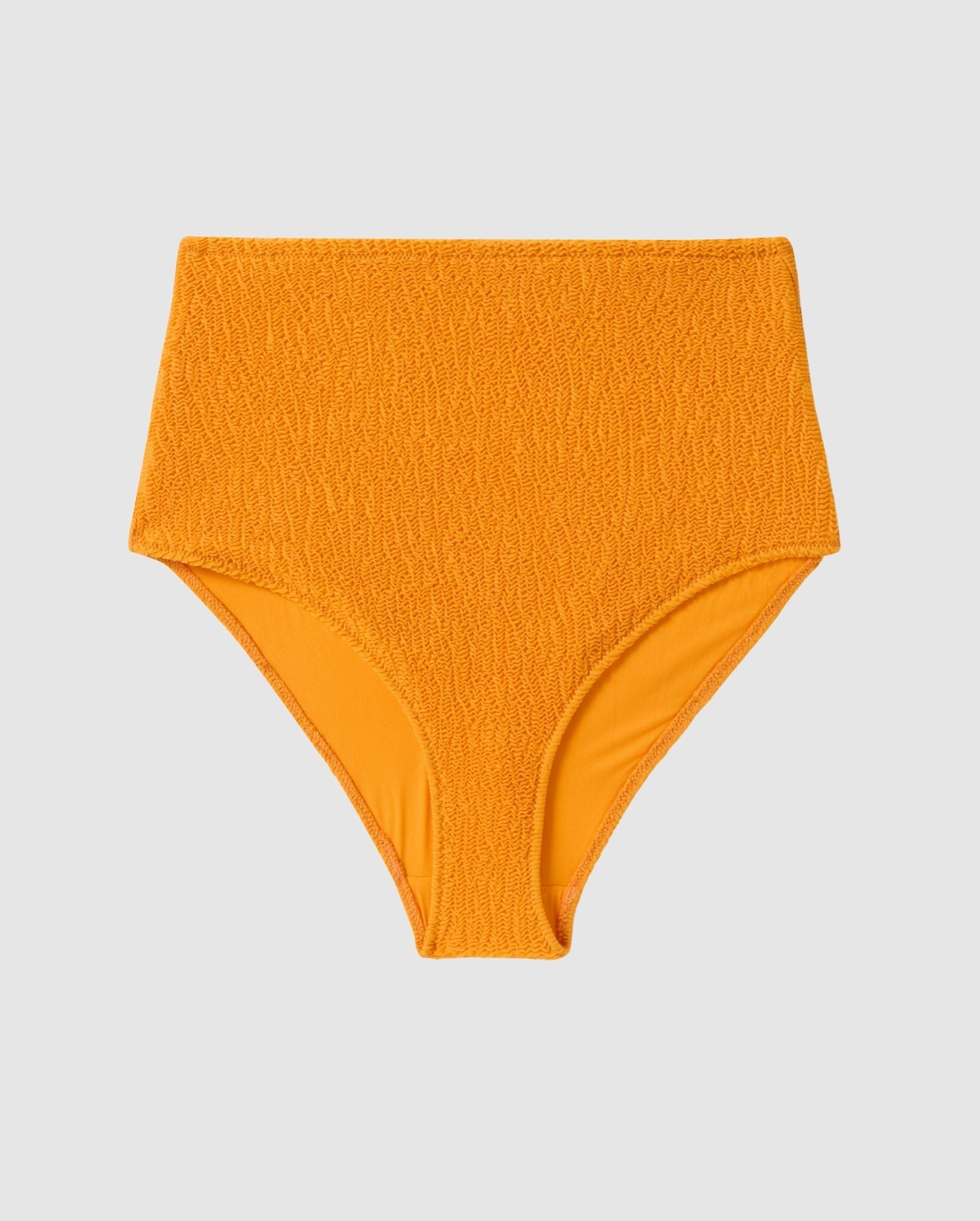 An high-waist bikini bottom in apricot orange.