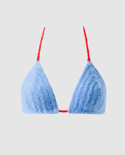 An knitted triangle bralette in light blue.