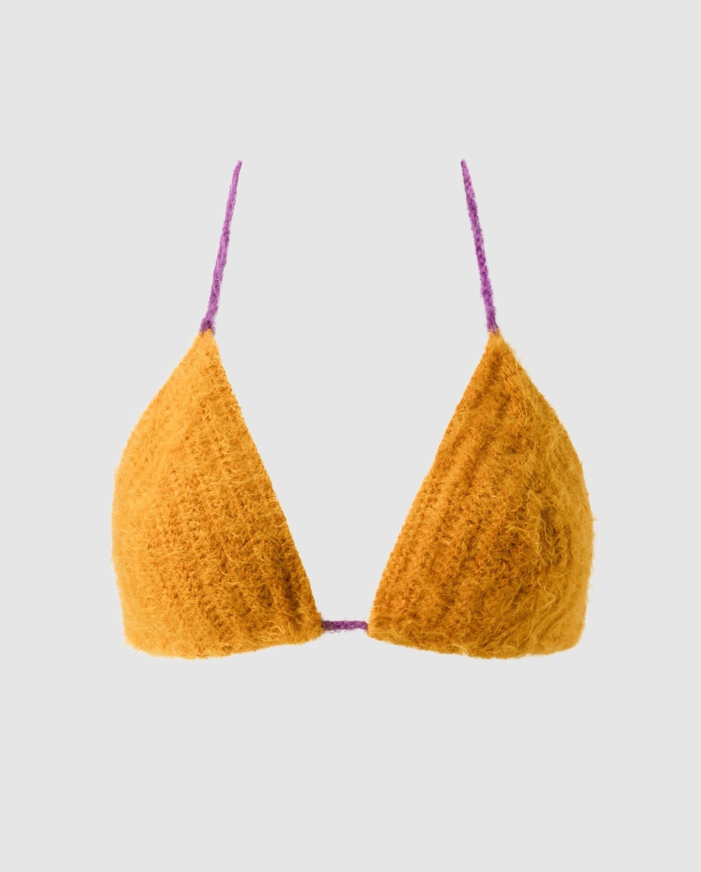 An knitted triangle bralette in mustard color.