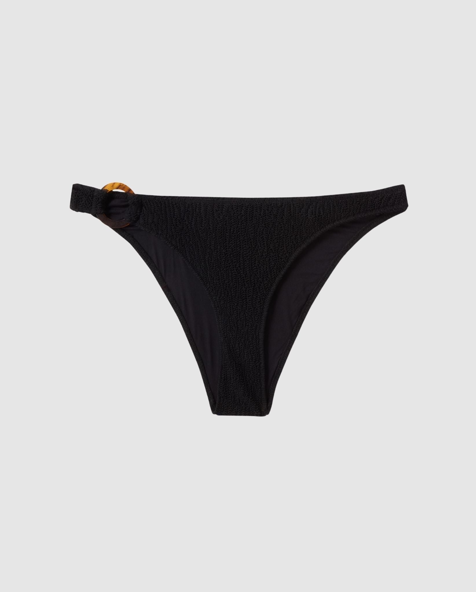 An black bikini bottom in with a ring accessory.