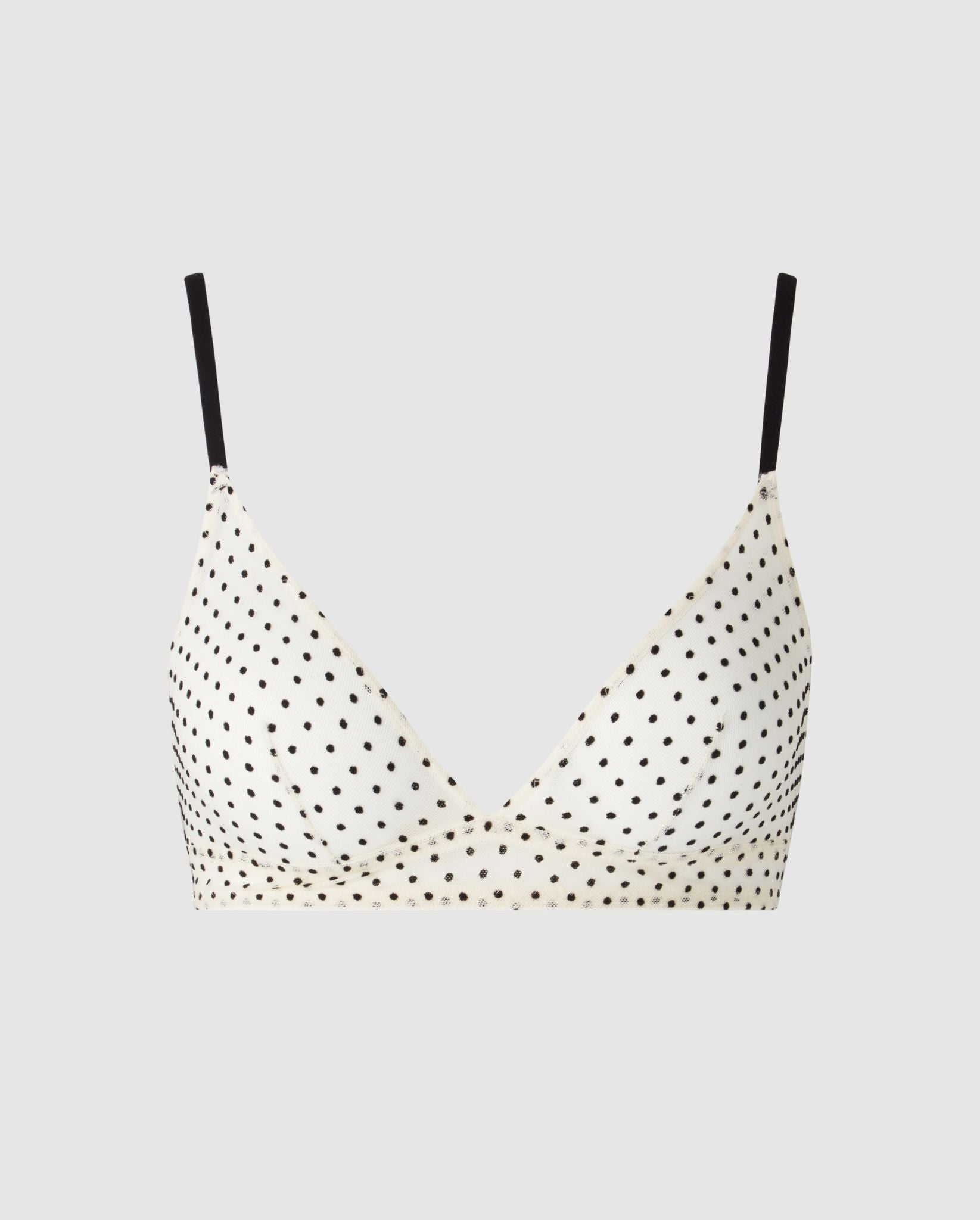 An cream and black, triangle shaped bralette in mesh.
