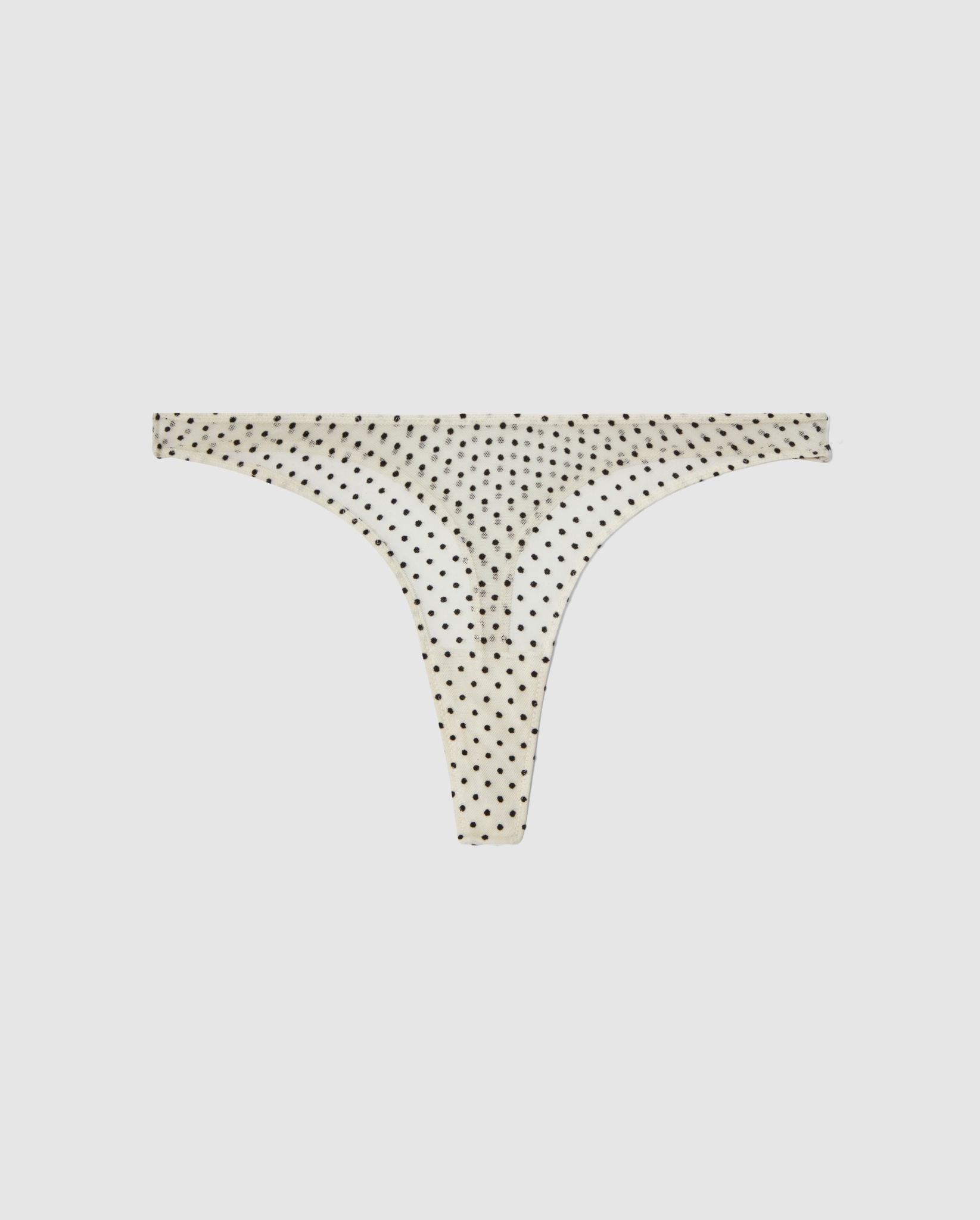 An Mesh mid rise high cut design in a cream and black dots color. 