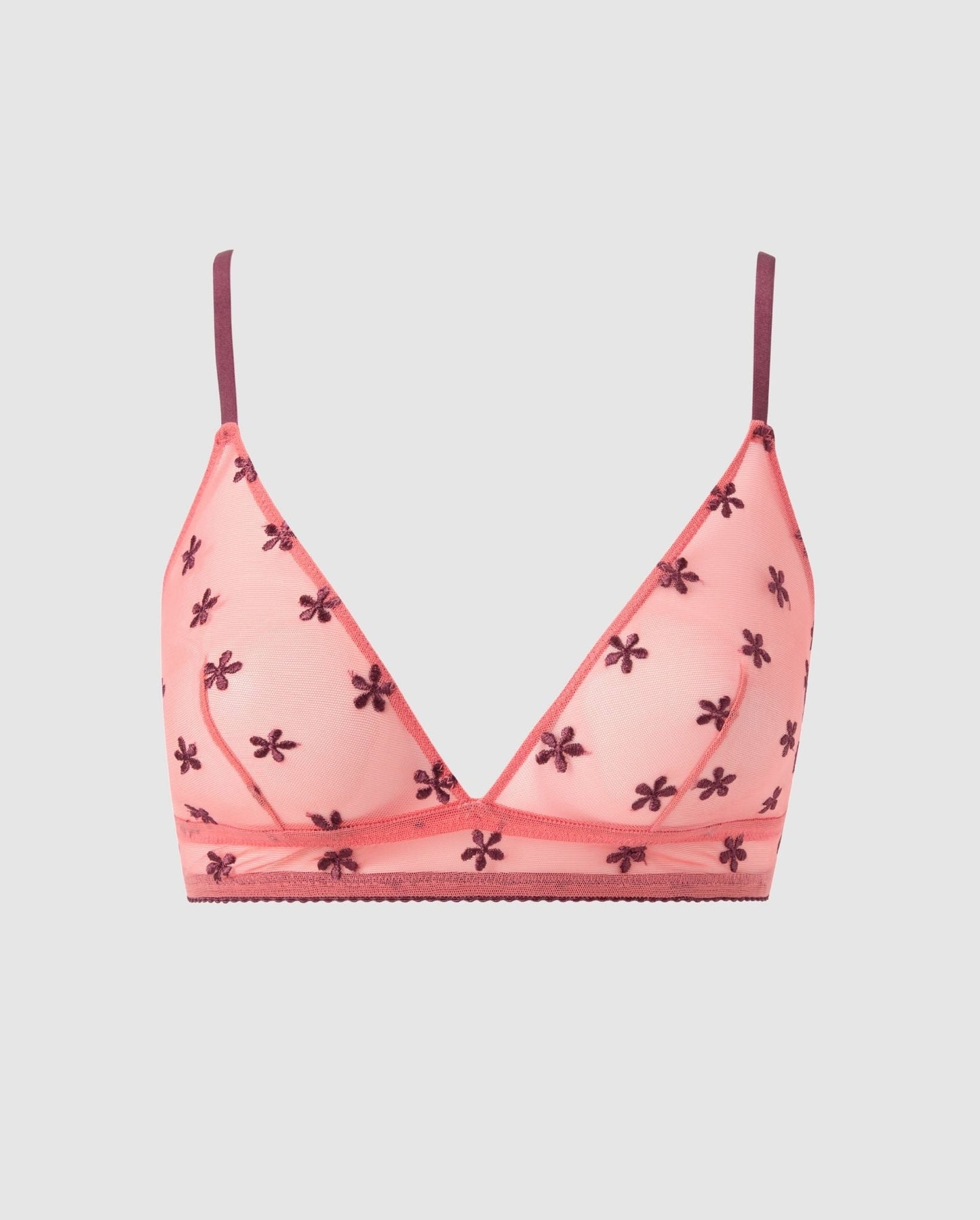 An mesh triangle bralette in a coral pink and cherry flower design.