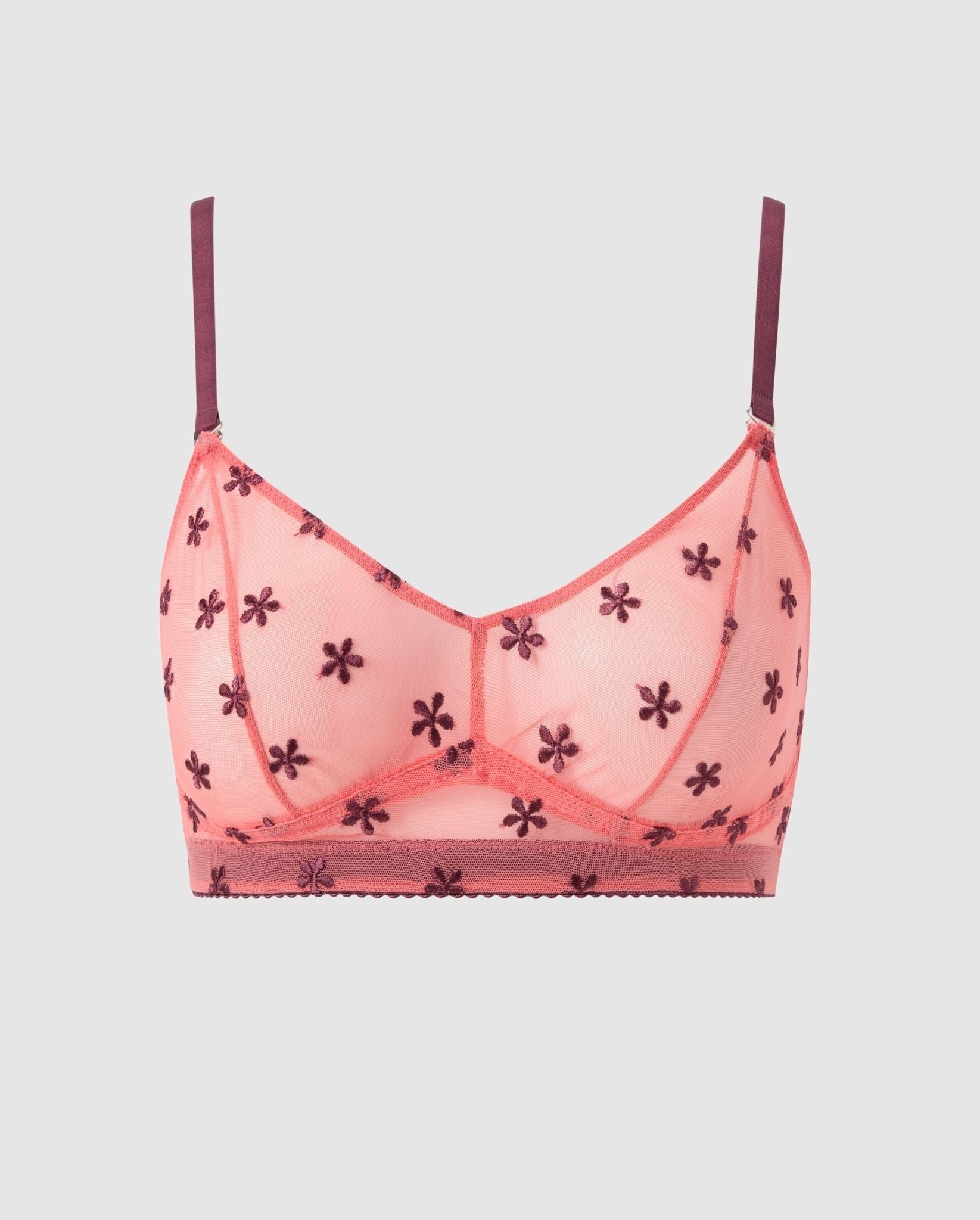 An mesh balconette in coral pink with cherry flower accessories.