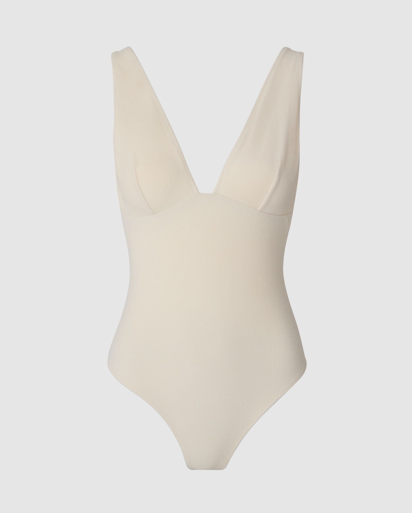 An plunge swimsuit in cream white.