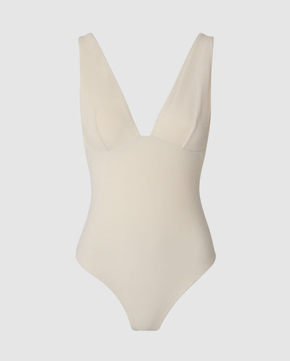 An plunge swimsuit in cream white.