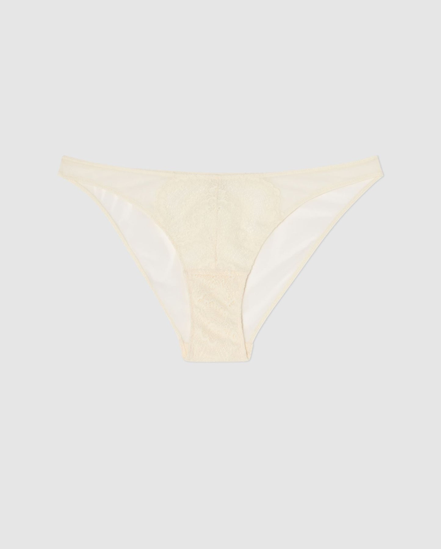 An mesh bikini brief with lace accessories in cream white.