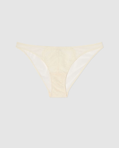 An mesh bikini brief with lace accessories in cream white.