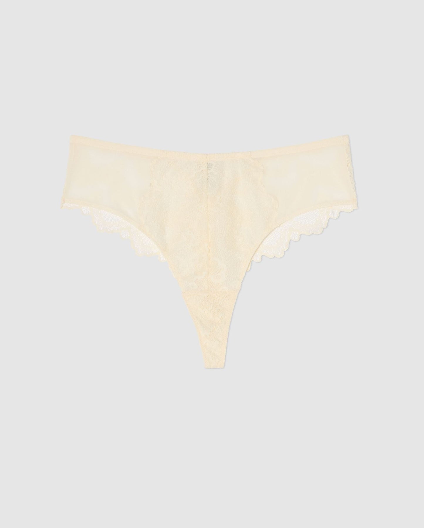 An mesh highwaist high cut pantie in cream with lace accessories.