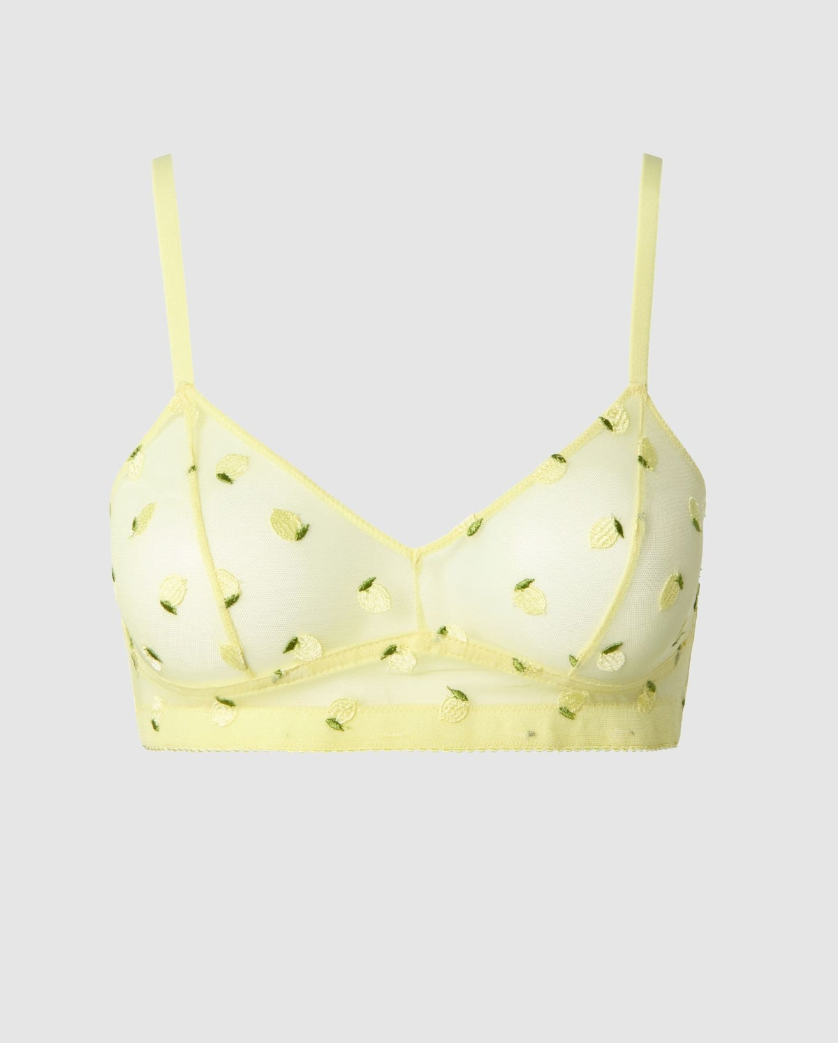 An mesh balconette in a light yellow with citrus accessories.