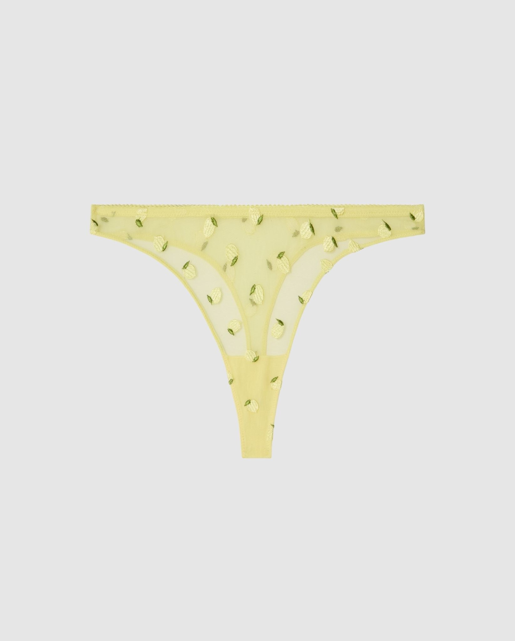 An mid rise high cut panty in light yellow mesh with lemon accessories.