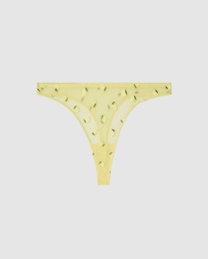An mid rise high cut panty in light yellow mesh with lemon accessories.
