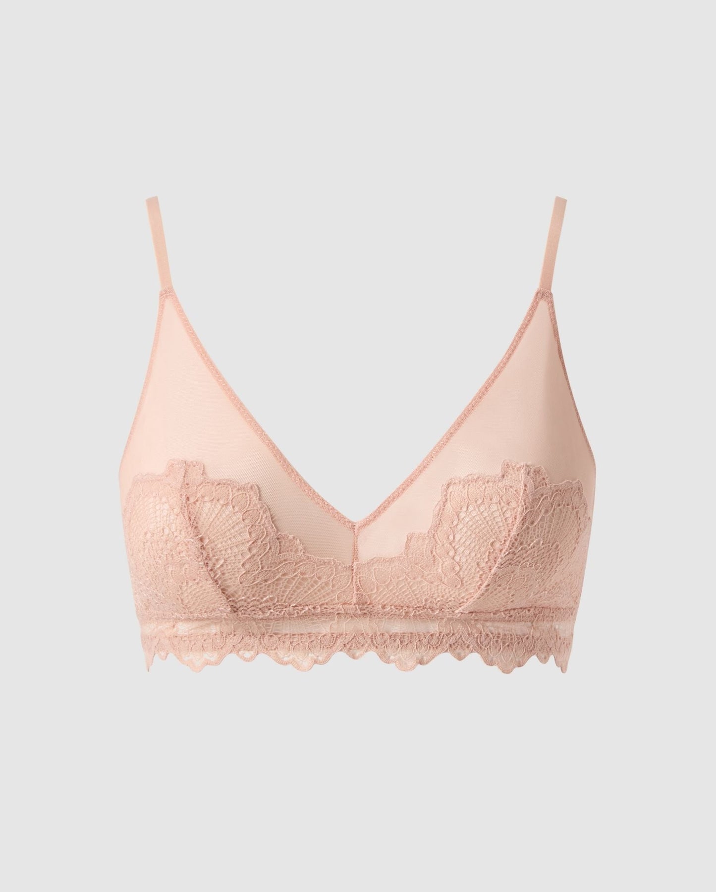 An lace triangle bralette with mesh accessories in beige.