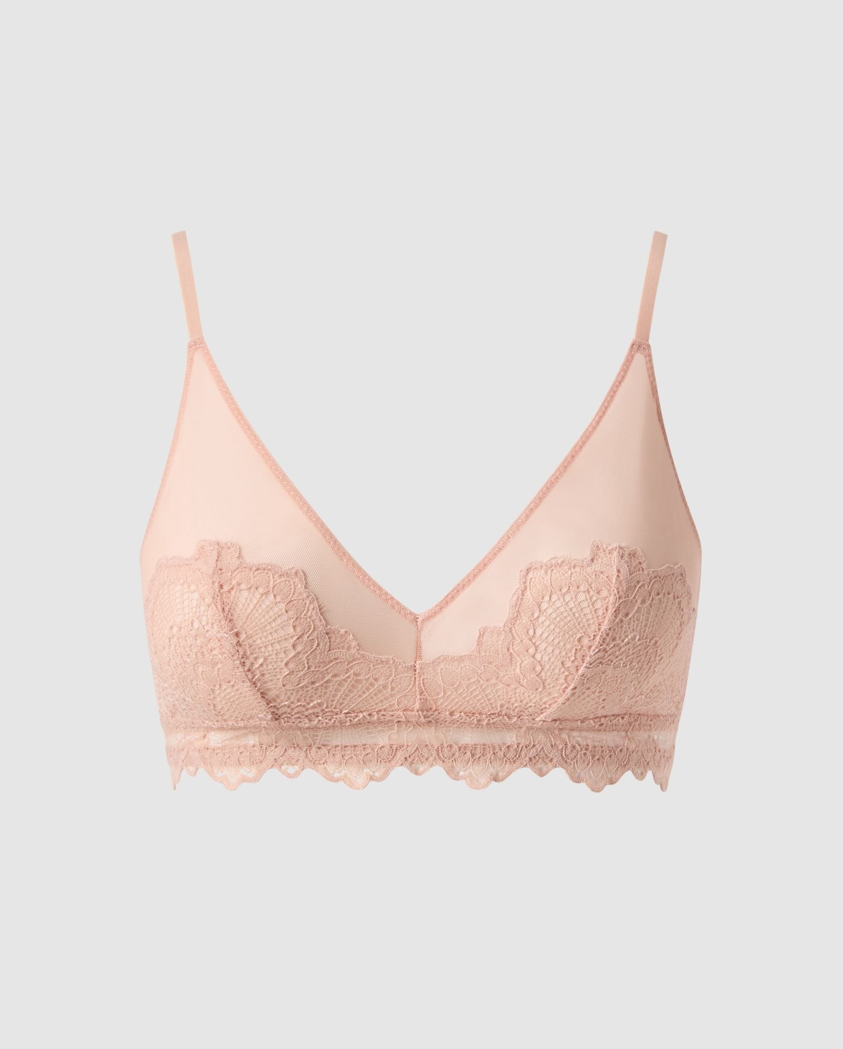 An lace triangle bralette with mesh accessories in beige.