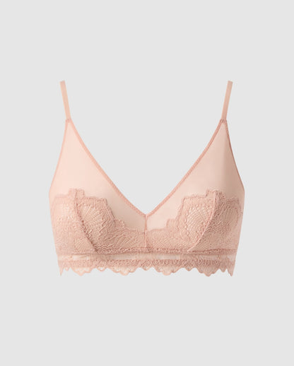 An lace triangle bralette with mesh accessories in beige.