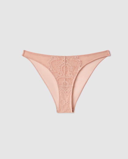 An mesh bikini brief in beige with lace accessories.