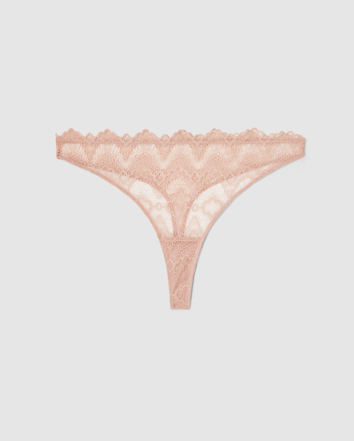 An mid rise high cut panty in beige lace.