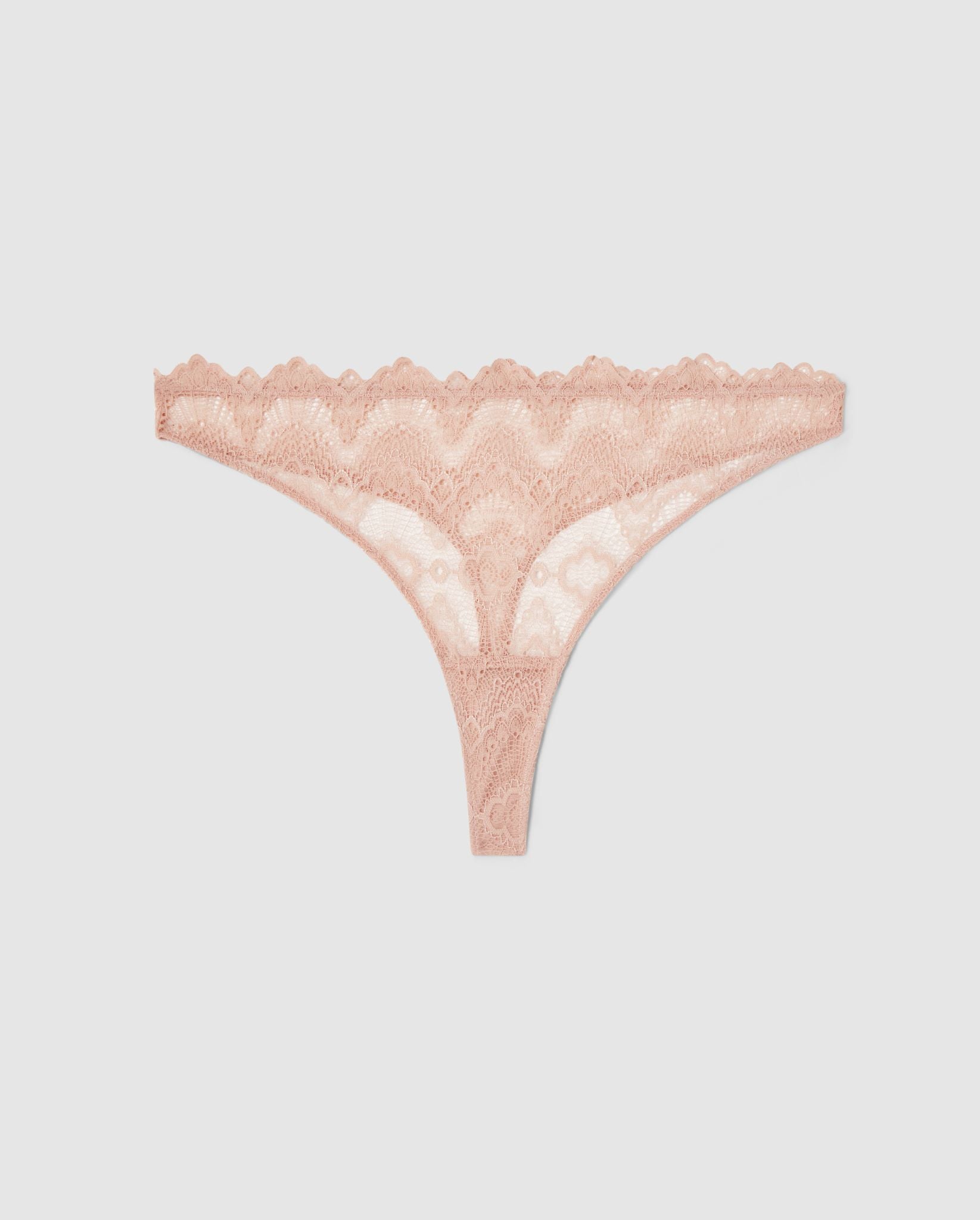 An mid rise high cut panty in beige lace.