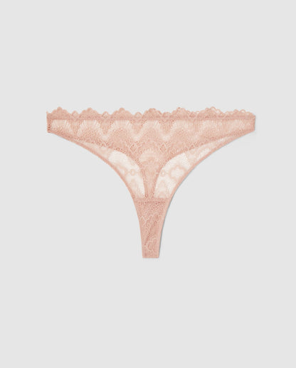An mid rise high cut panty in beige lace.