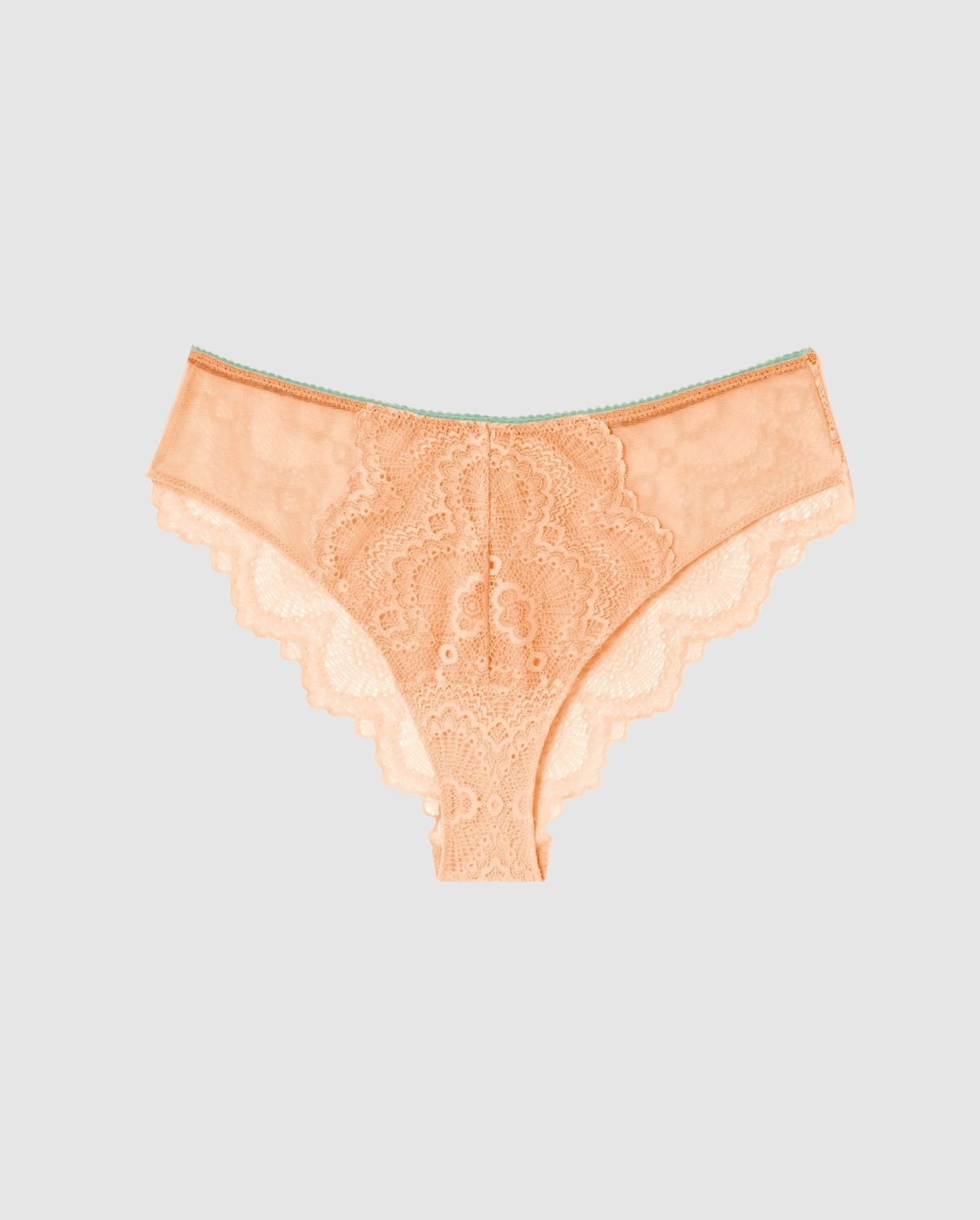 An flattering lace panty in peach pink with turquoise accessories.