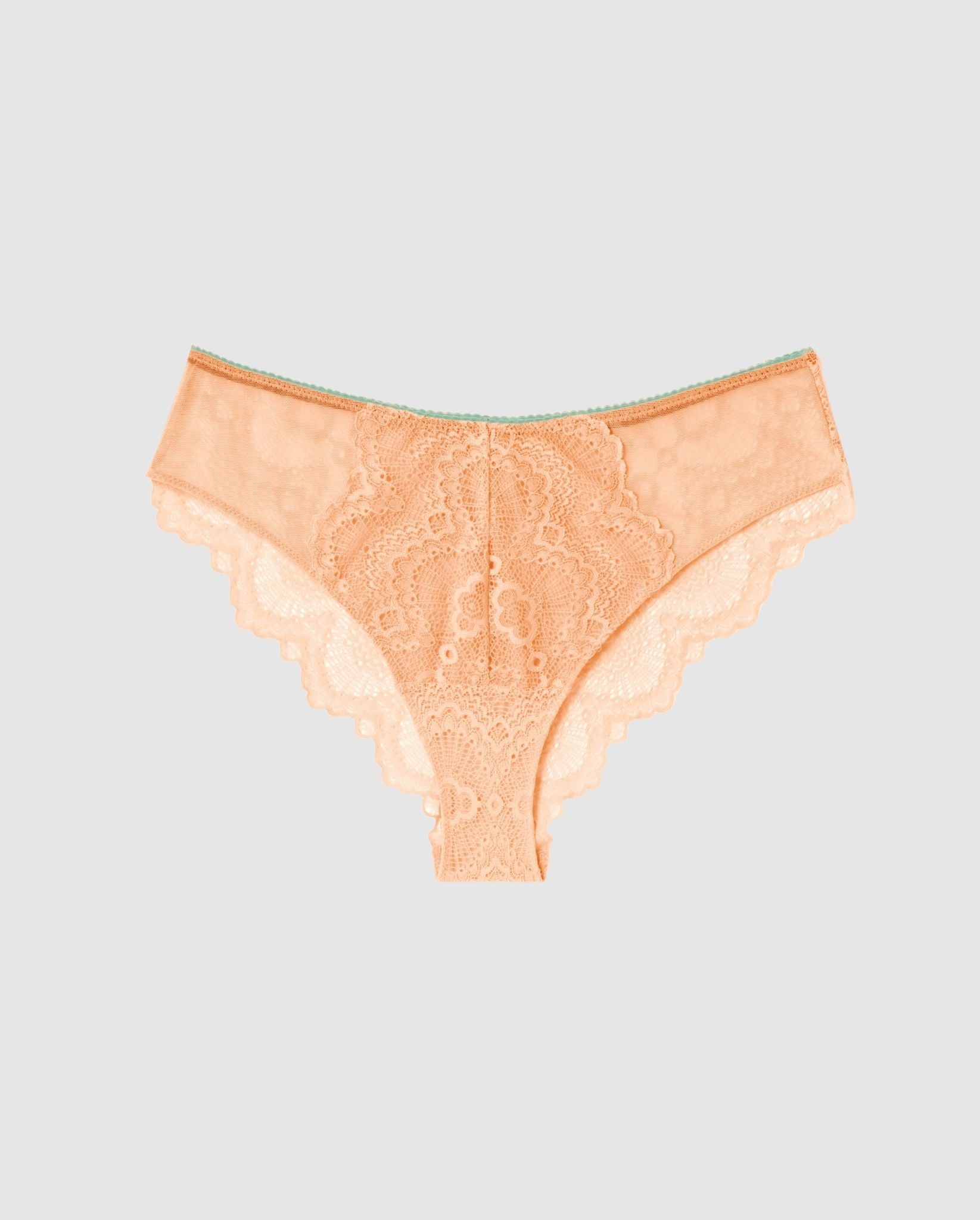 An flattering lace panty in peach pink with turquoise accessories.