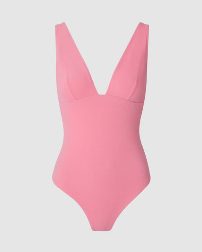 An plunge neck swimsuit in candy pink.