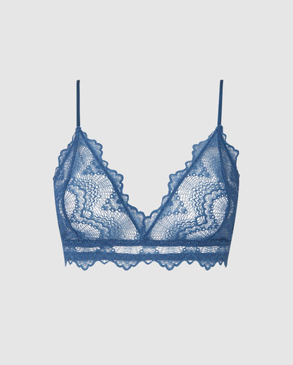 An lace triangle bralette in a faded blue color.