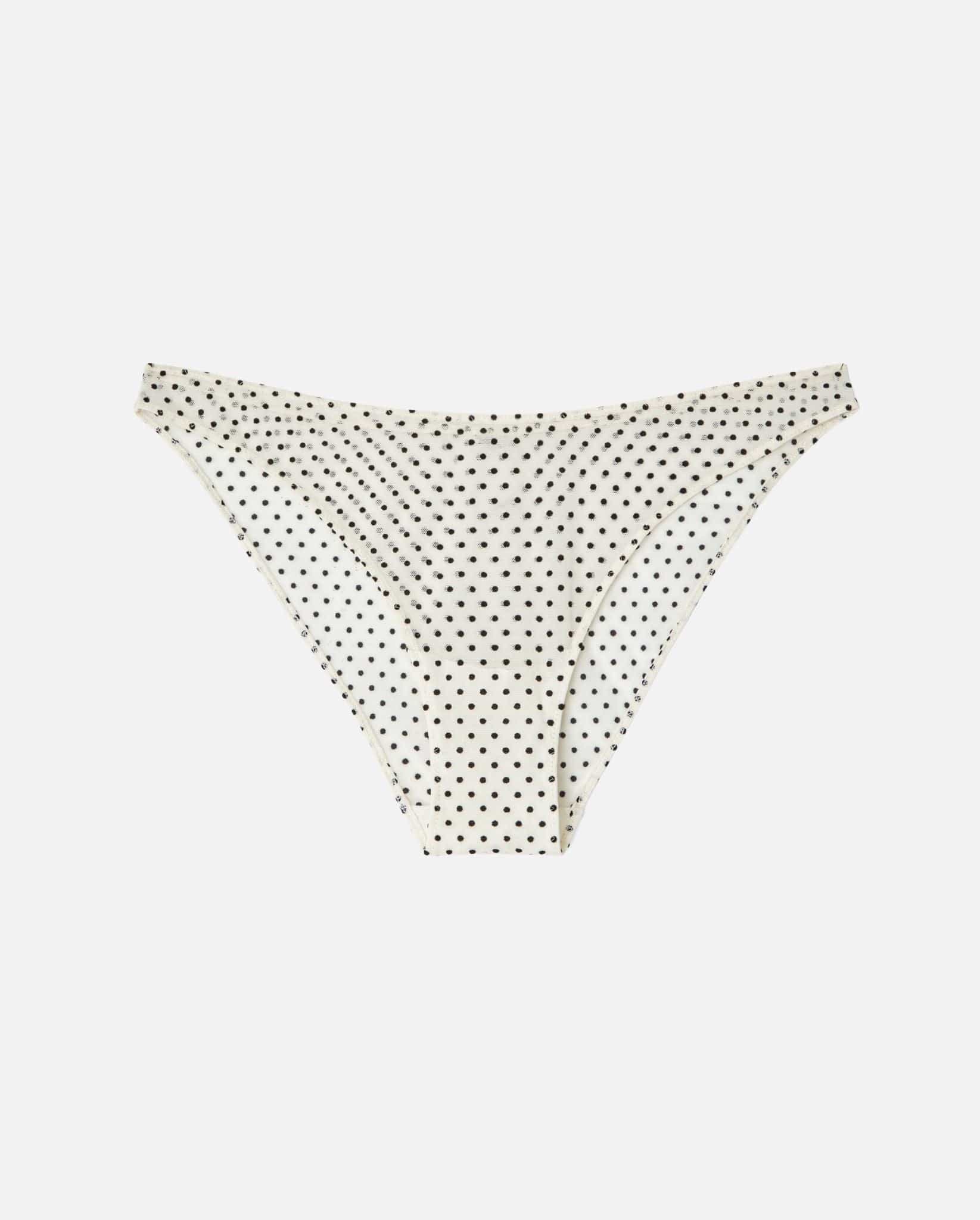 An Mesh Bikini brief with a cream and black dot design. 