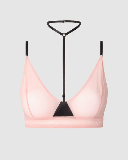 An rose pink mesh bralette with black accessories.